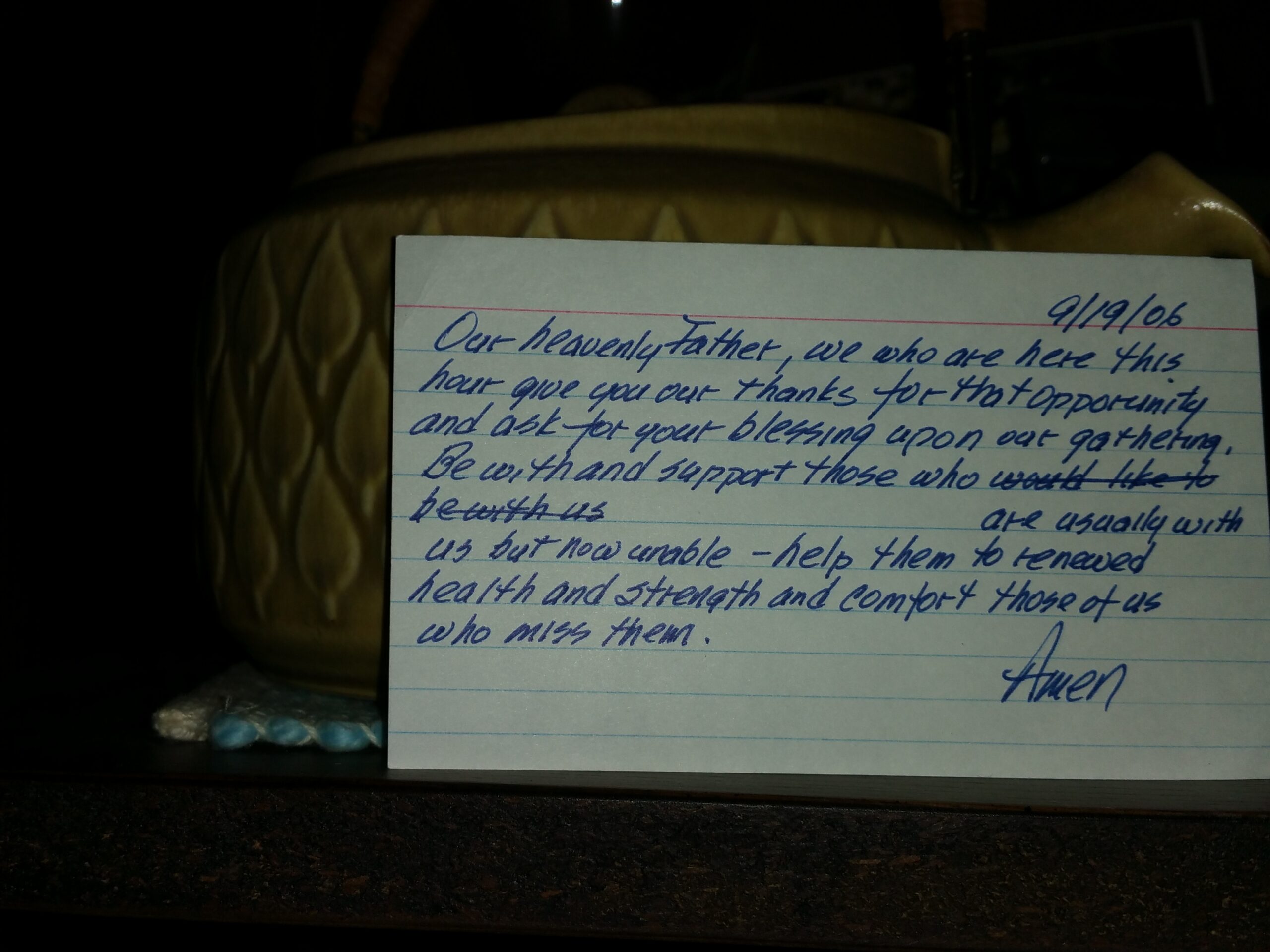 index card prayer in front of pottery teapot