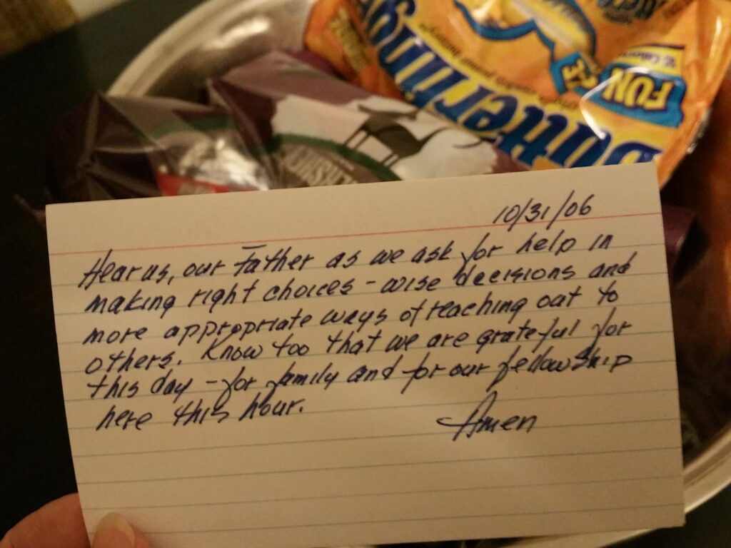 index card prayer with open back of candy bars