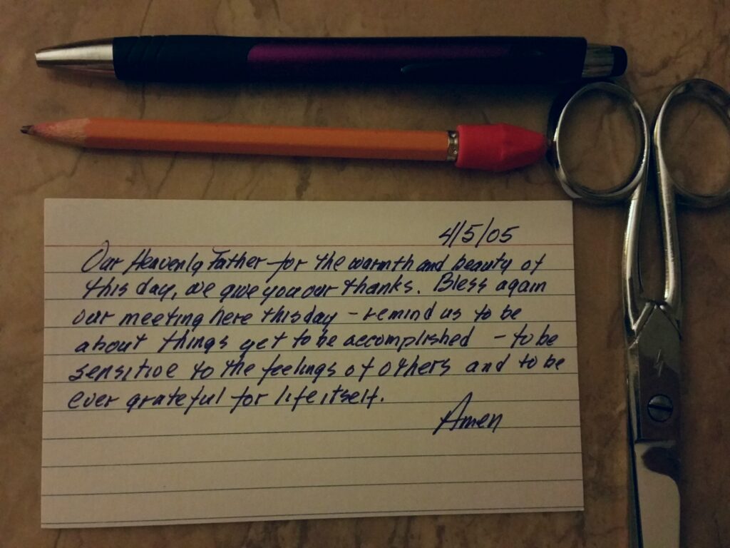 index card with pen pencil and scissors