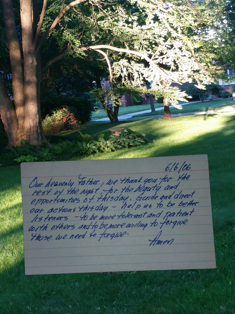 index card prayer superimposed on view of yard