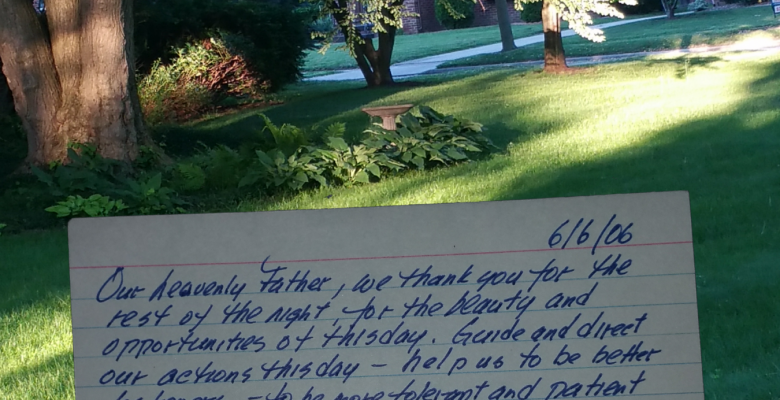 index card prayer superimposed on view of yard